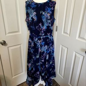 Sleeveless navy blue/pink paisley print dress with asymmetrical hem line.